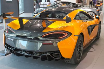 Striking rear view with large rear wing and aerodynamic features