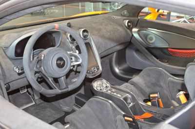 Carbon fiber interior with racing bucket seats and steering wheel.