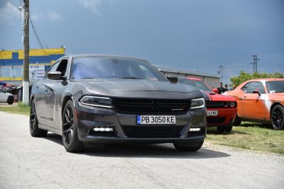 Aggressive front fascia with LED daytime running lights and black grille