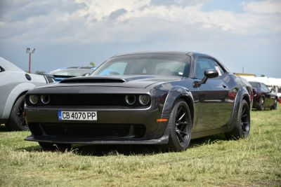 Muscle coupe with hood scoop and black alloy wheels