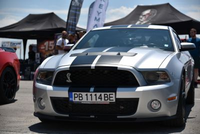 Front view with hood vents and black racing stripes