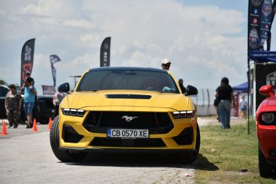 Front view with aggressive headlights and large grille
