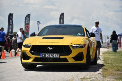 Yellow Mustang VII front with aggressive headlights and prominent grille