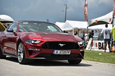 Aggressive front grille with sharp headlights on performance coupe.