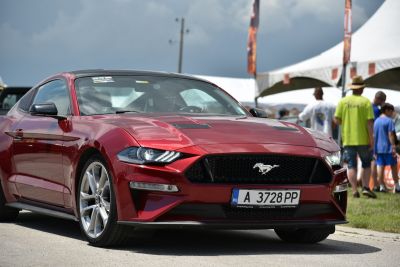Aggressive front grille with LED headlights on a sleek sports coupe