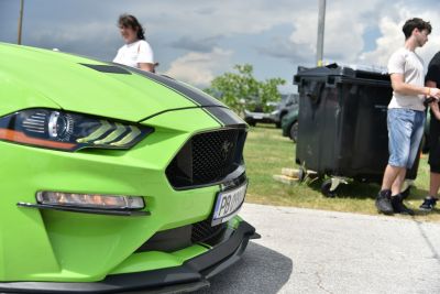 Close-up of aggressive headlights and sporty hood stripes