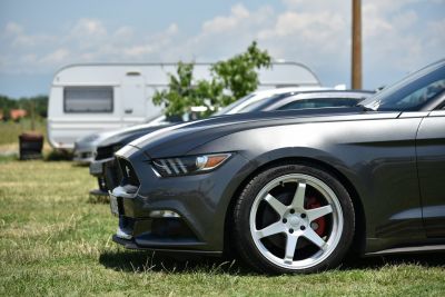Sleek front headlight and alloy wheel with red brake calipers