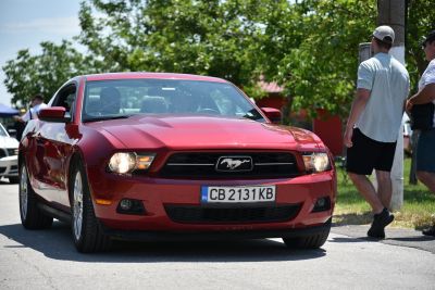Front view of car with Mustang emblem and headlights