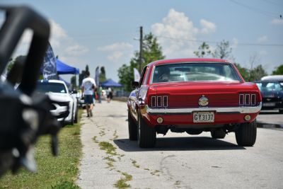 Rear view showing iconic triple taillights and wide tires