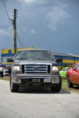 Front view of pickup truck with grille and headlights