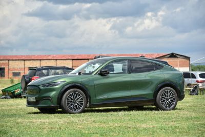 Side view of sleek electric SUV with aerodynamic design and alloy wheels