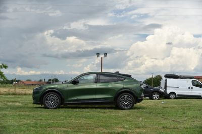 Side profile of electric SUV with modern alloy wheels and sleek design.