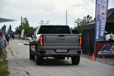 Rear view of a pickup truck with iconic tail lights and short cargo bed.