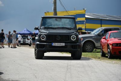 Front view with round LED headlights and prominent grille
