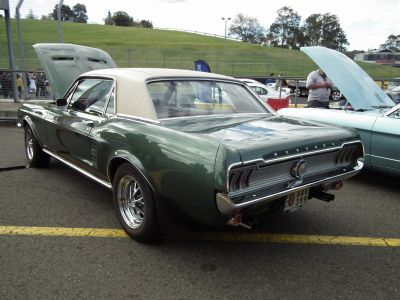 Classic rear side view of a 1967 hardtop coupe with distinctive taillights and chrome bumper