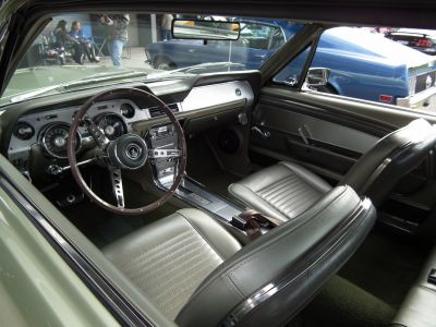 Classic vintage car interior with steering wheel and dashboard