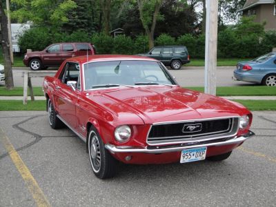 Red classic Mustang front grille and round headlights