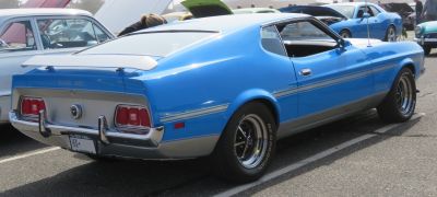 Rear-side view with spoiler and racing stripes
