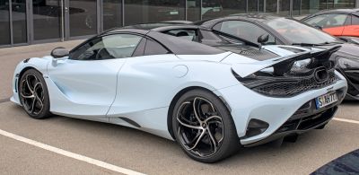 Rear side view with aerodynamic body and alloy wheels