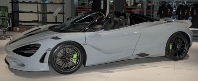 Convertible luxury sports car with black alloy wheels and aerodynamic design