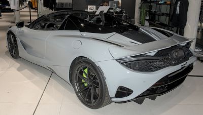 Rear view of convertible sports car with aerodynamic spoiler and open roof