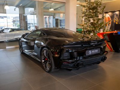 Sleek aerodynamic rear and sporty exhaust setup with stylish wheels