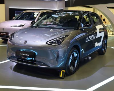 Sleek electric hatchback with smooth aerodynamic shape and prominent LED headlights