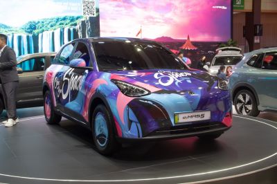 Colorful electric vehicle with custom artwork in front view