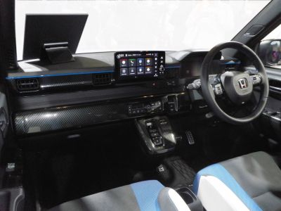 Touchscreen and carbon fiber interior with steering wheel details