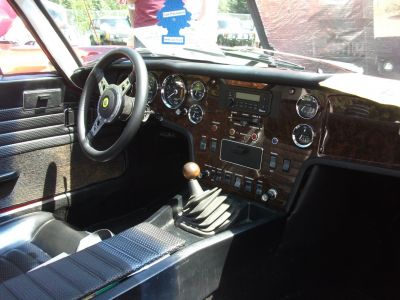 Classic vintage car interior with wood dashboard and manual gear shift