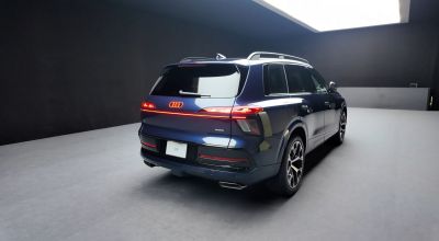 Rear view of luxury SUV with LED tail lights and dual exhaust
