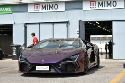 Sharp angular headlamps and aggressive front fascia in sports coupe design