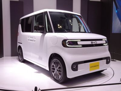 LED-lit compact electric microvan with boxy design and modern features.