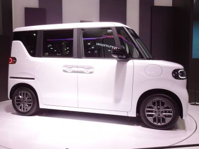 Compact boxy electric vehicle with sliding doors and LED lighting