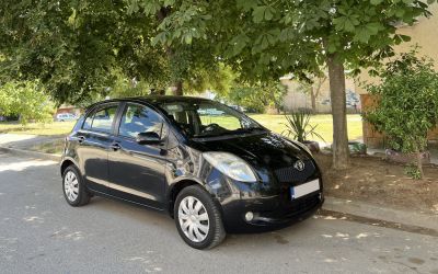 Compact hatchback with rounded headlights and smooth curved body.