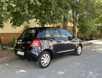 Rear and side view of compact five-door hatchback with distinct taillights.