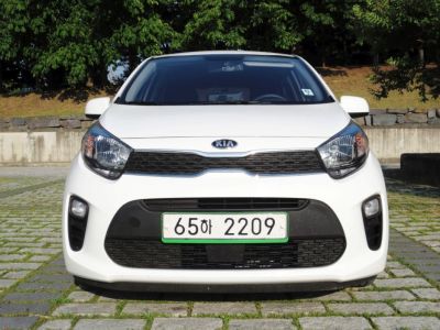 Front view with distinctive headlights and grille design