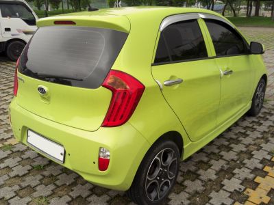 Compact hatchback rear with distinctive tail lights and alloy wheels
