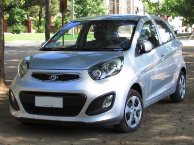 Front view of compact hatchback with modern headlights and grille