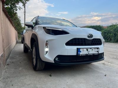 Front view showing sleek headlights and robust grille