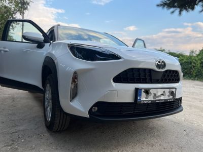 Front angle with headlights, grille, and open doors
