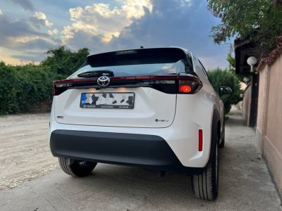 Rear view of a hybrid hatchback with distinctive taillights and modern design.