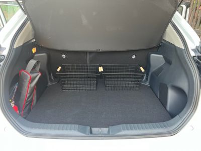 Spacious trunk with metal storage baskets and organized cargo space