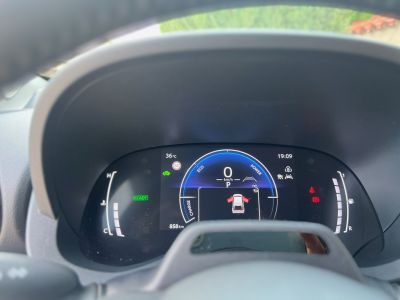 Modern digital instrument cluster displaying speed, eco mode, and vehicle status.