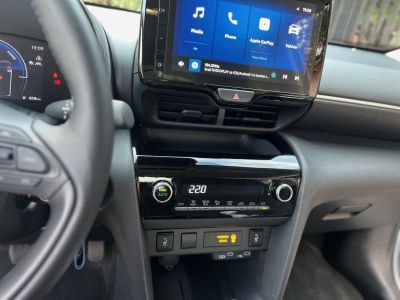 Touchscreen infotainment and digital climate control panel.