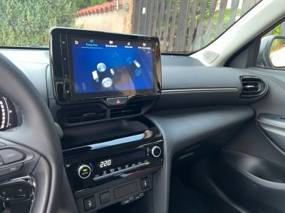 Dashboard with touchscreen infotainment and climate control system.