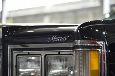 Close-up of front dual headlights and Mercury emblem