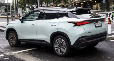 Rear side view of modern SUV with sharp taillights and alloy wheels