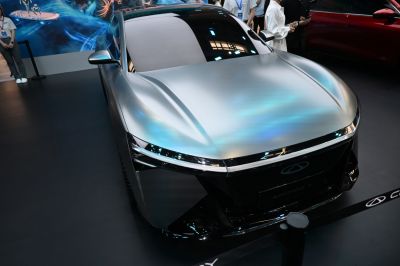 Front view with sleek LED headlights and smooth futuristic hood design