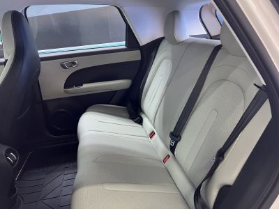 Rear seat with light leather upholstery and seat belts